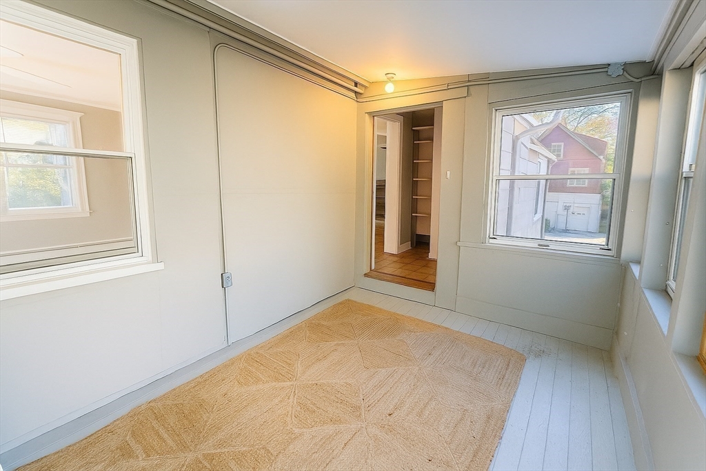 133 Brattle Street, Unit 2 Arlington, MA 02474 - Photo 11 of 15 an empty room with windows