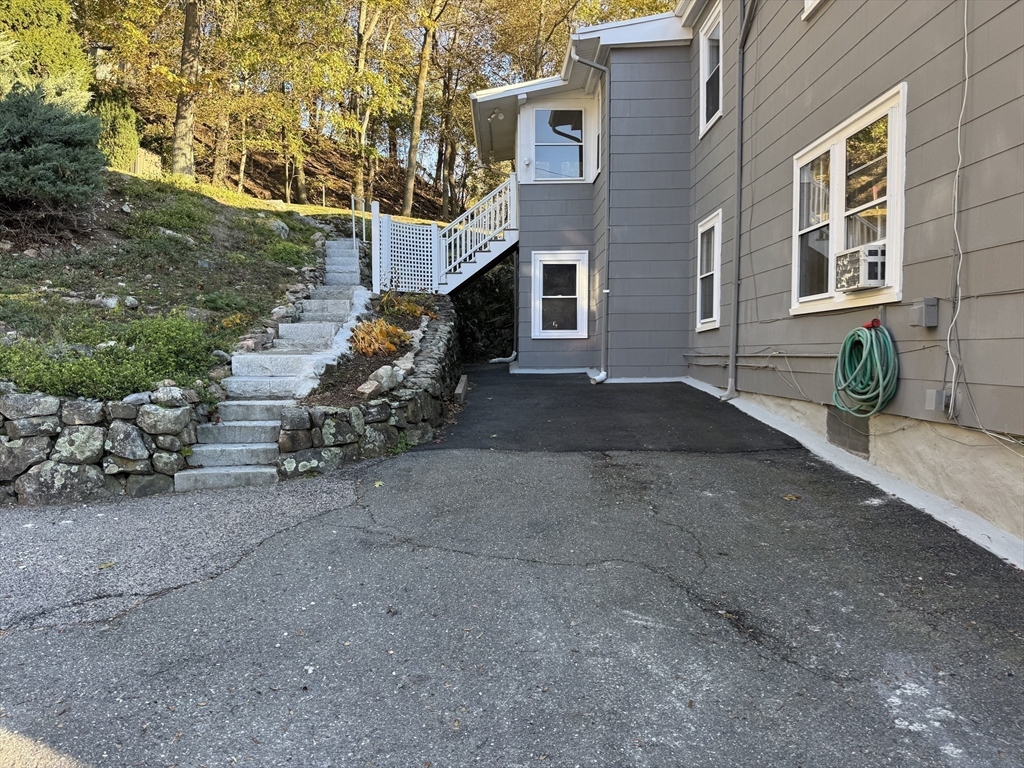 133 Brattle Street, Unit 2 Arlington, MA 02474 - Photo 14 of 15 a view of a house with sitting area and painting on the wall