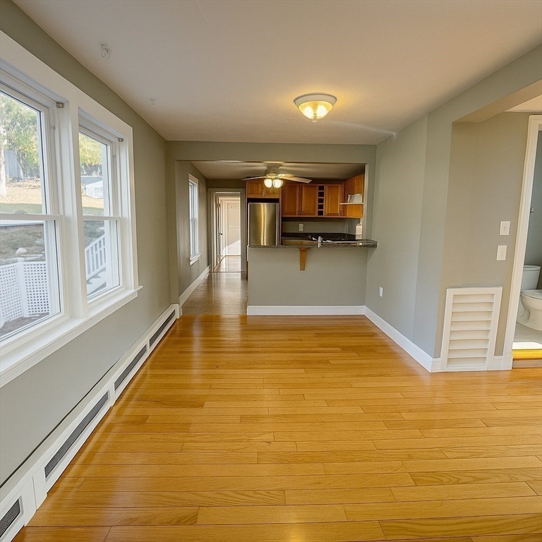 133 Brattle Street, Unit 2 Arlington, MA 02474 - Photo 5 of 15 a view of a bathtub in a room with a window
