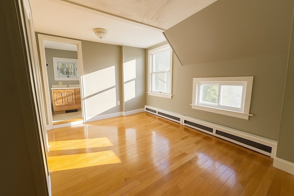 133 Brattle Street, Unit 2 Arlington, MA 02474 - Photo 7 of 15 a view of an empty room with a window