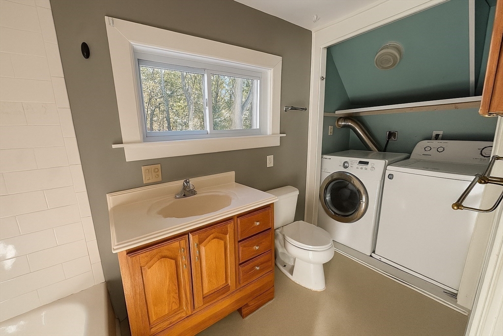 133 Brattle Street, Unit 2 Arlington, MA 02474 - Photo 10 of 15 a utility room with dryer and washer