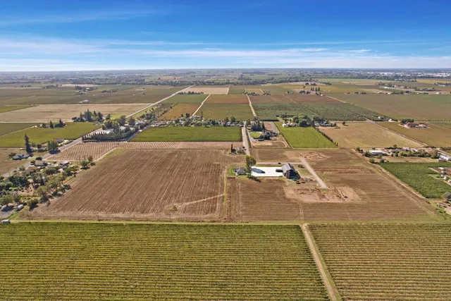 an aerial view of residential building and ocean view