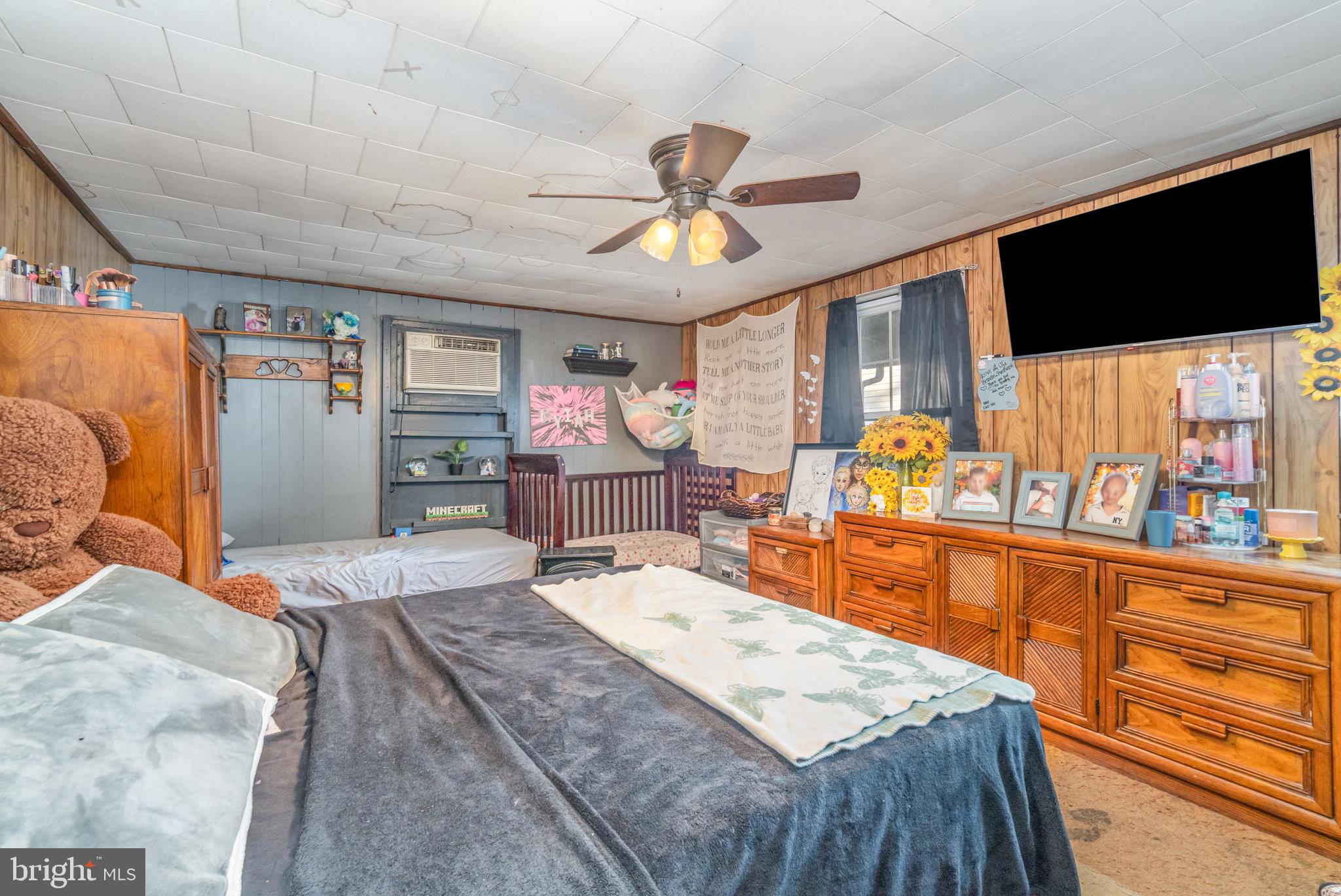 137 Oak Flat Road Newville, PA 17241 - Photo 11 of 36 a living room with stainless steel appliances kitchen island granite countertop furniture and a flat screen tv