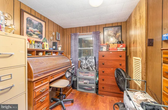 a room with musical instruments and wooden floor