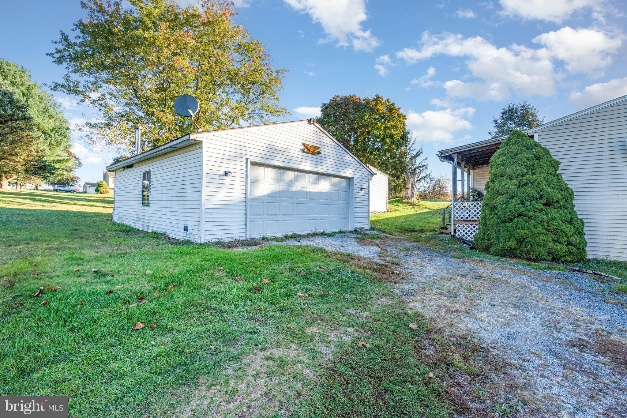 137 Oak Flat Road Newville, PA 17241 - Photo 31 of 36 a view of a backyard with large trees and plants