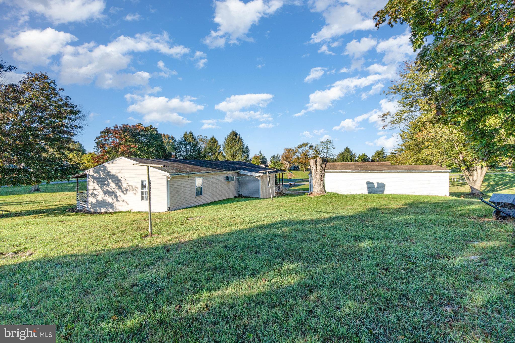 137 Oak Flat Road Newville, PA 17241 - Photo 33 of 36 a front view of a house with a yard and a large tree