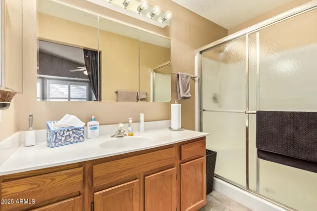 a view of a balcony with a ceiling fan