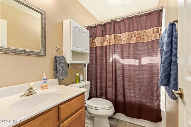 a view of a golf course with a palm tree