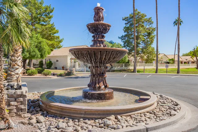a view of swimming pool with seating area