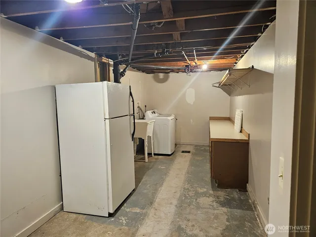 a view of a storage & utility room with washer and dryer