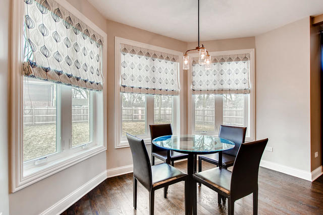462 Northgate Court Riverside, IL 60546 - Photo 12 of 36 a dining room with furniture window and wooden floor