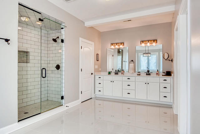 462 Northgate Court Riverside, IL 60546 - Photo 19 of 36 a bathroom with a double vanity sink mirror and shower