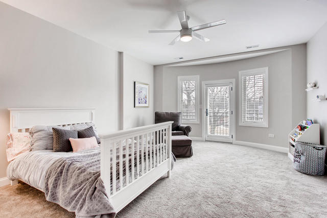 462 Northgate Court Riverside, IL 60546 - Photo 21 of 36 a bedroom with a bed and ceiling fan