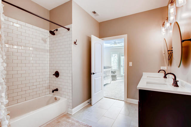 462 Northgate Court Riverside, IL 60546 - Photo 22 of 36 a bathroom with a tub sink and mirror