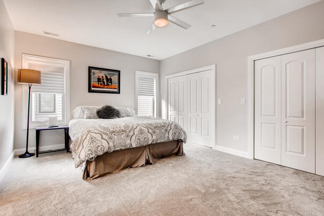 462 Northgate Court Riverside, IL 60546 - Photo 23 of 36 a bedroom with a bed and a chandelier