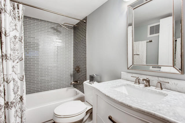 462 Northgate Court Riverside, IL 60546 - Photo 29 of 36 a bathroom with a granite countertop bathtub shower sink vanity mirror and toilet