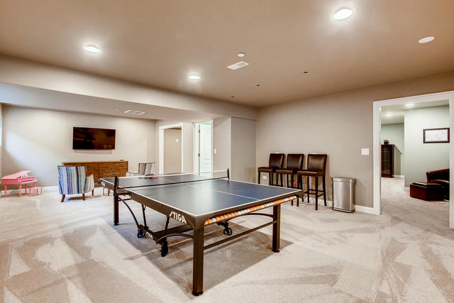 462 Northgate Court Riverside, IL 60546 - Photo 31 of 36 a living room with furniture a flat screen tv and a table
