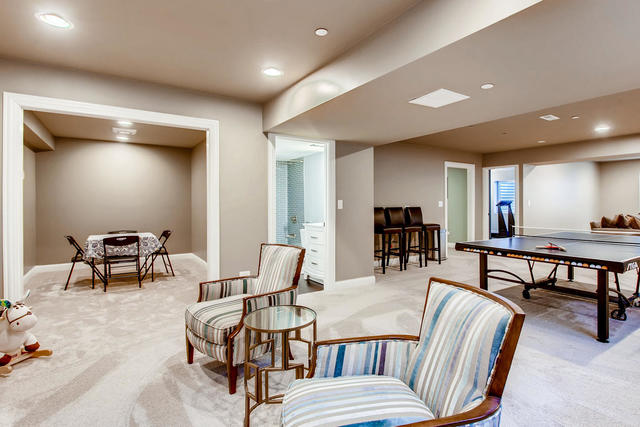 462 Northgate Court Riverside, IL 60546 - Photo 32 of 36 a living room with furniture and a dining table with wooden floor