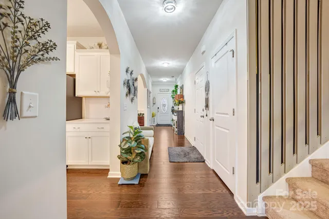 a view of an entryway with wooden floor