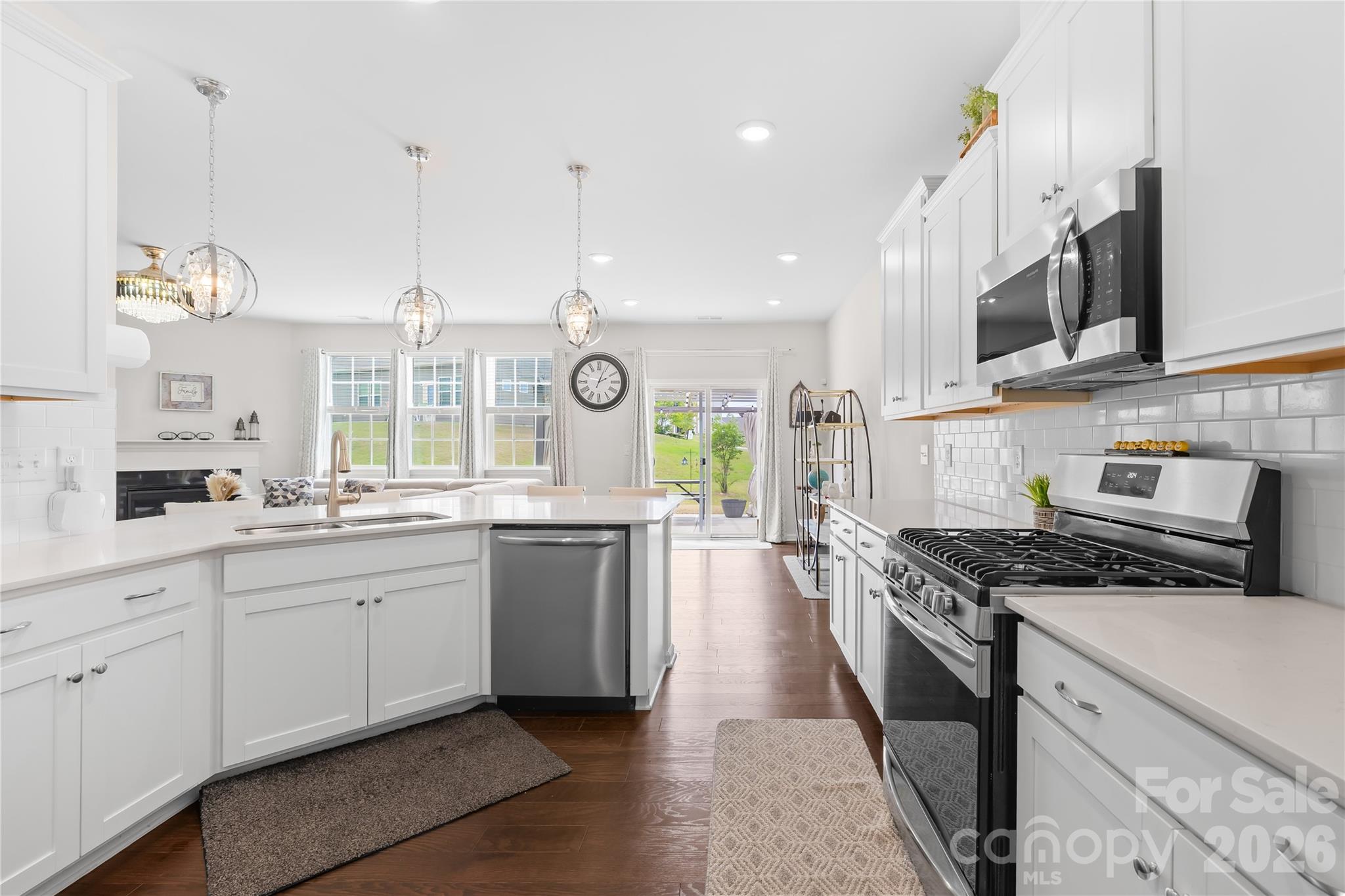 1741 Wildwood Terrace Trail Fort Mill, SC 29708 - Photo 17 of 47 a kitchen with stainless steel appliances granite countertop a stove a sink and a microwave