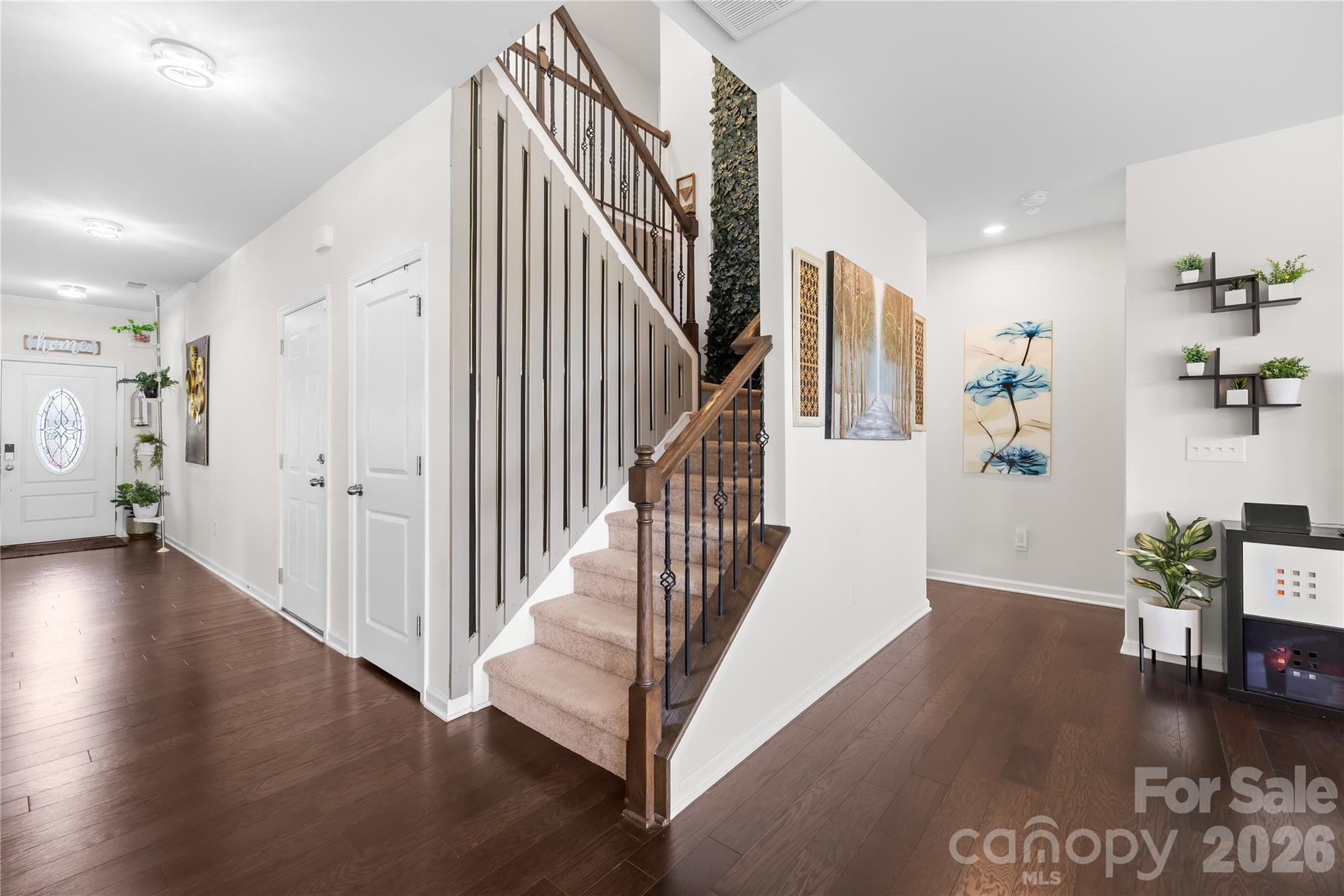 1741 Wildwood Terrace Trail Fort Mill, SC 29708 - Photo 19 of 47 a view of a hallway with wooden floor and stairs