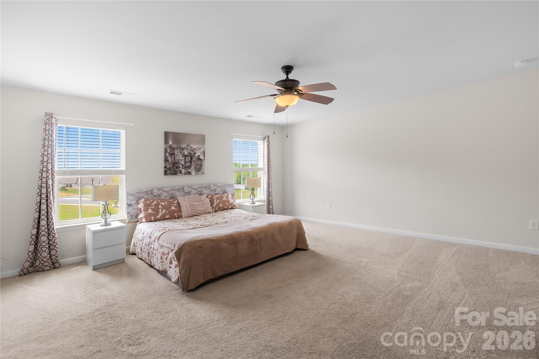 1741 Wildwood Terrace Trail Fort Mill, SC 29708 - Photo 26 of 47 a spacious bedroom with a bed and a window