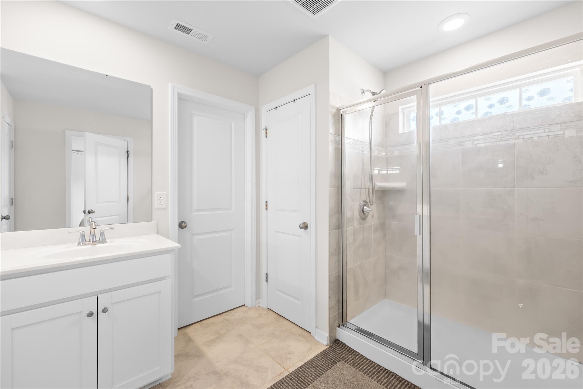 1741 Wildwood Terrace Trail Fort Mill, SC 29708 - Photo 30 of 47 a bathroom with a shower sink and mirror