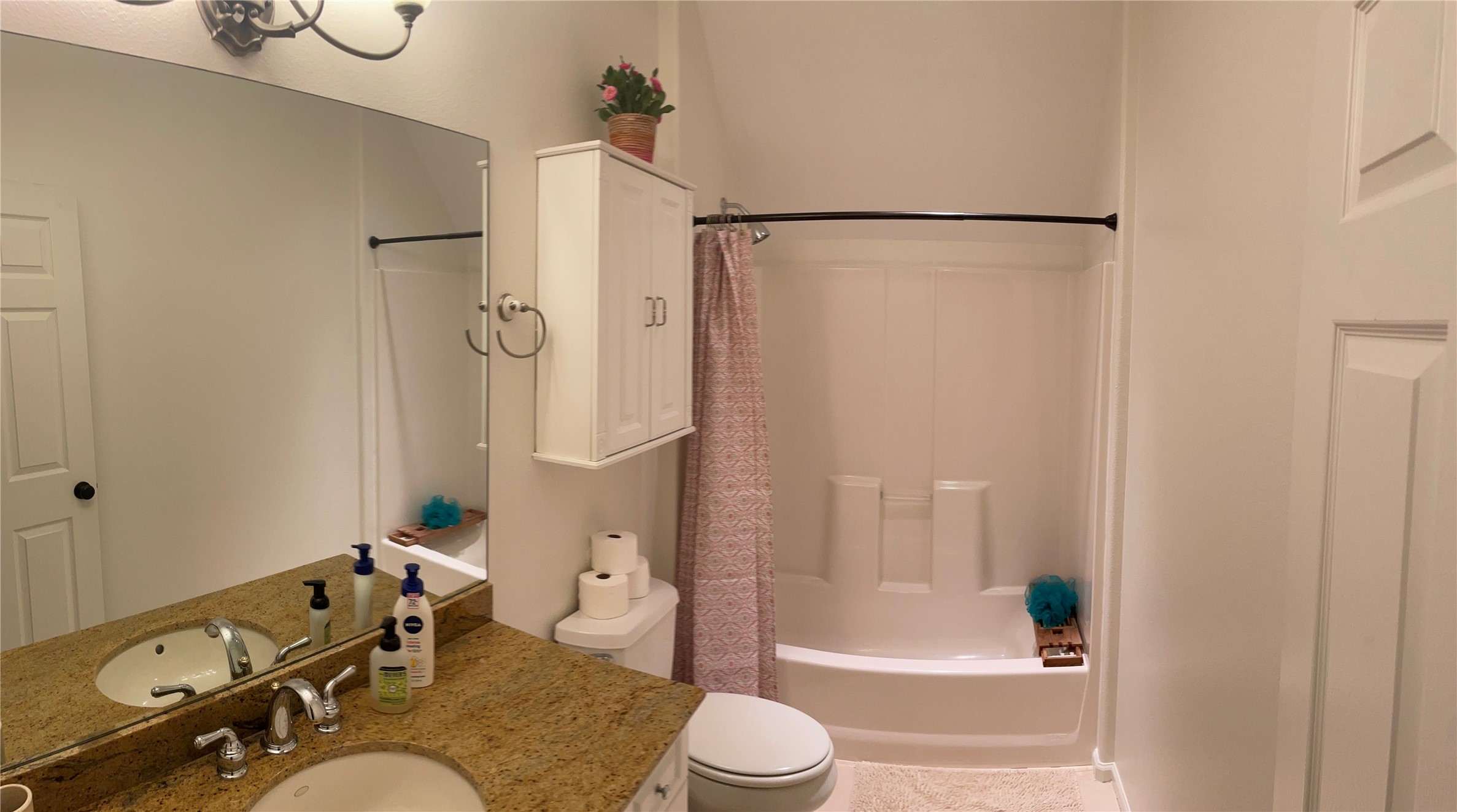 5 Maystar Court Spring, TX 77380 - Photo 24 of 26 a bathroom with a granite countertop bathtub shower sink and toilet