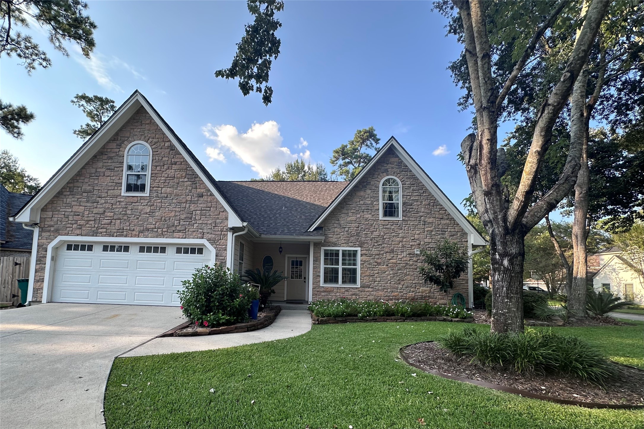 5 Maystar Court Spring, TX 77380 - Photo 3 of 26 a front view of a house with a yard