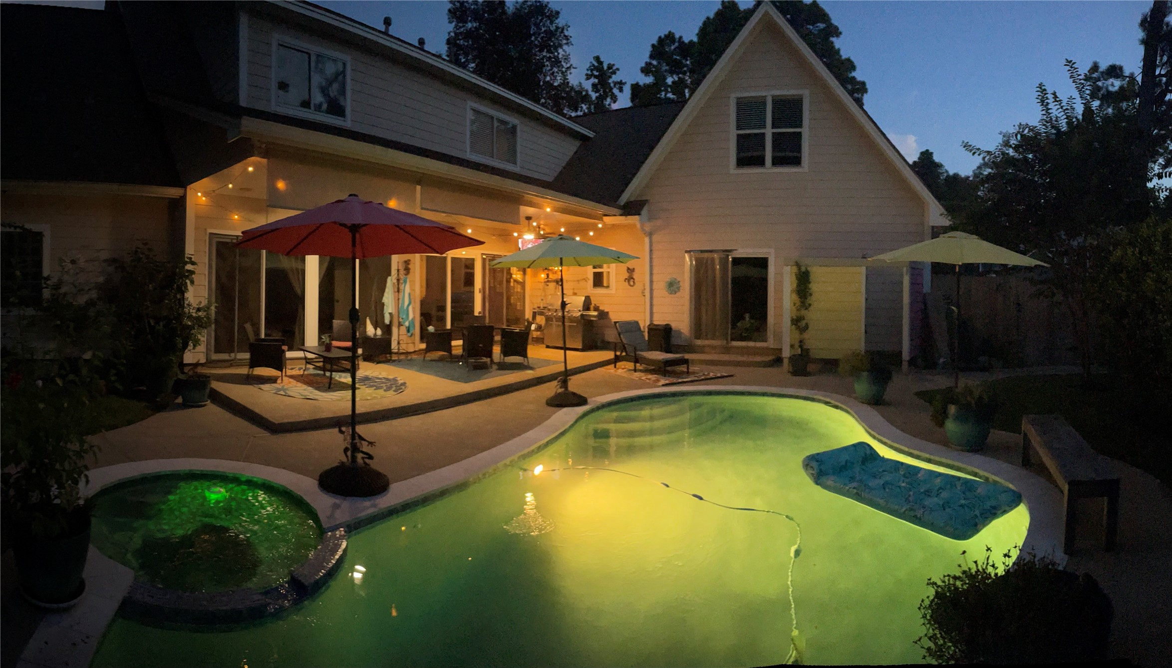 5 Maystar Court Spring, TX 77380 - Photo 4 of 26 a view of a patio with swimming pool table and chairs