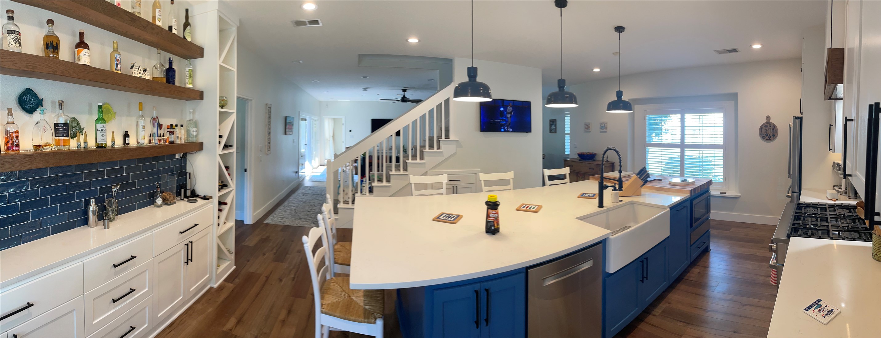 5 Maystar Court Spring, TX 77380 - Photo 5 of 26 a large kitchen with stainless steel appliances a large center island attached withe living room