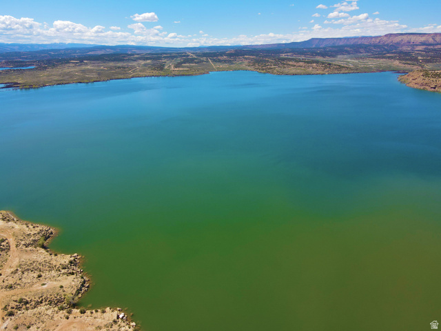 4500 South 22750th Duchesne, UT 84021 - Photo 33 of 34 Expansive lake with clear blue-green water and rugged, arid shoreline