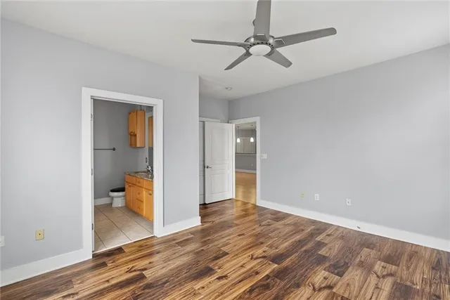 a view of an empty room and wooden floor