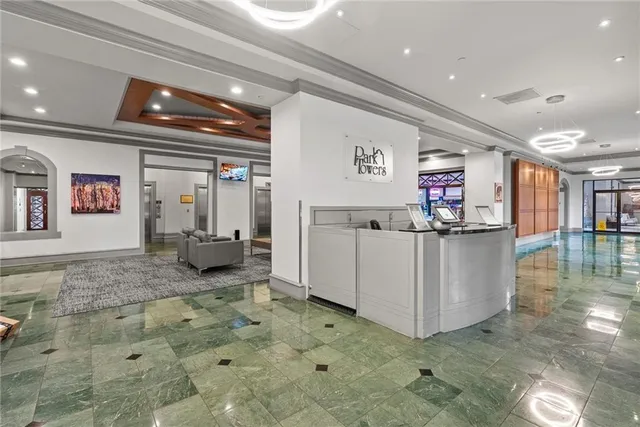 a view of a hallway with seating area