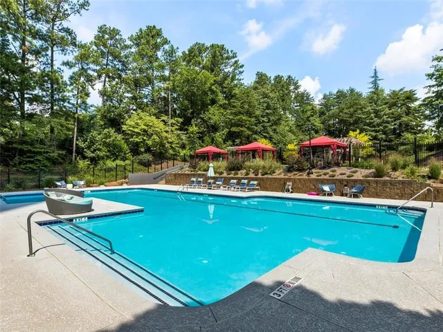 swimming pool view with a garden space