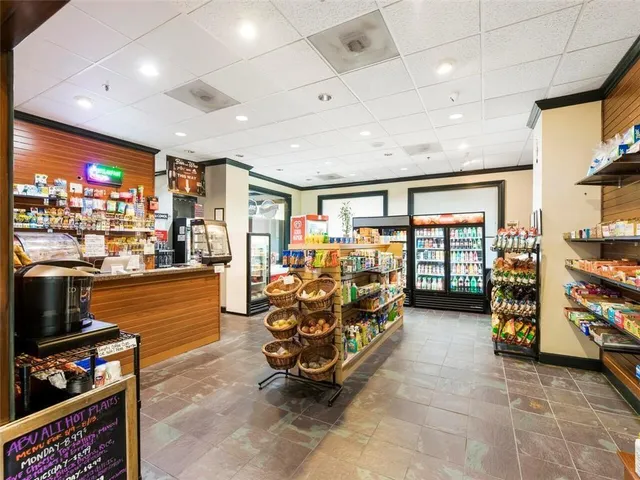 a room with lots of furniture and a flat screen tv