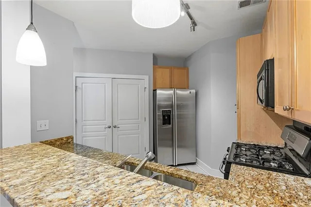 a bedroom with a bed and a window in it