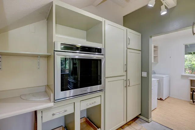 a view of kitchen with stainless steel appliances cabinets and a counter top space