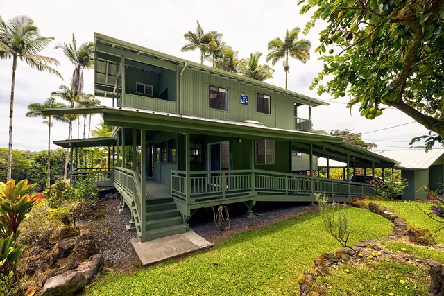 a view of house with swimming pool outdoor seating area