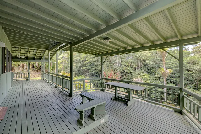 a balcony with furniture and wooden floor