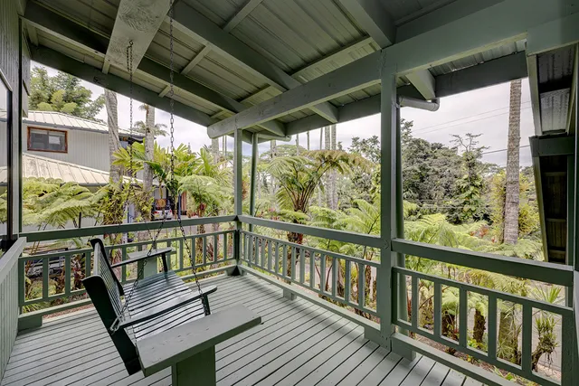 a view of a two chairs in the balcony