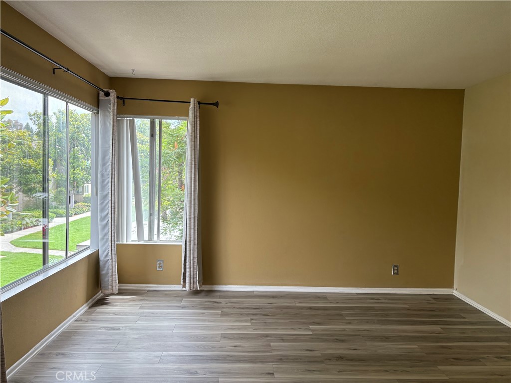 70 Echo Run, Unit 31 Irvine, CA 92614 - Photo 3 of 19 a view of an empty room with a window