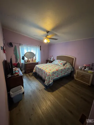 a bedroom with bed and window