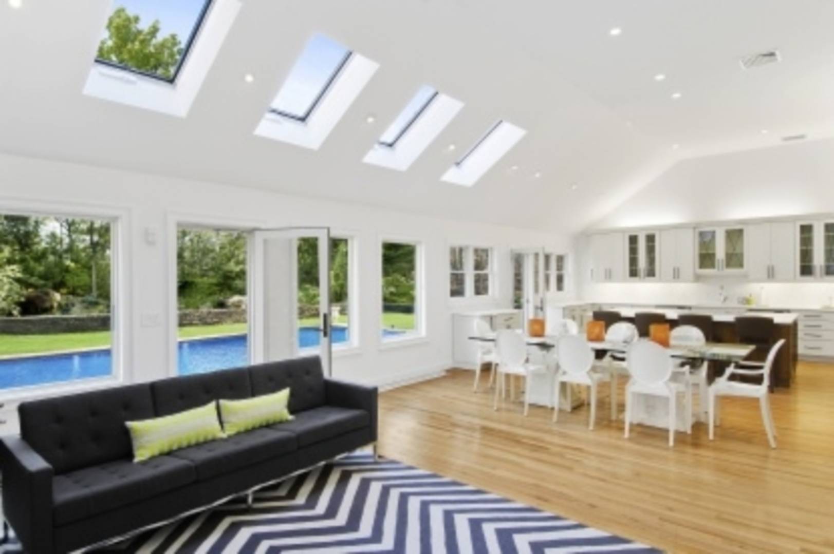 26 Cedar Trail East Hampton, NY 11937 - Photo 1 of 16 a living room with furniture wooden floor and a large window