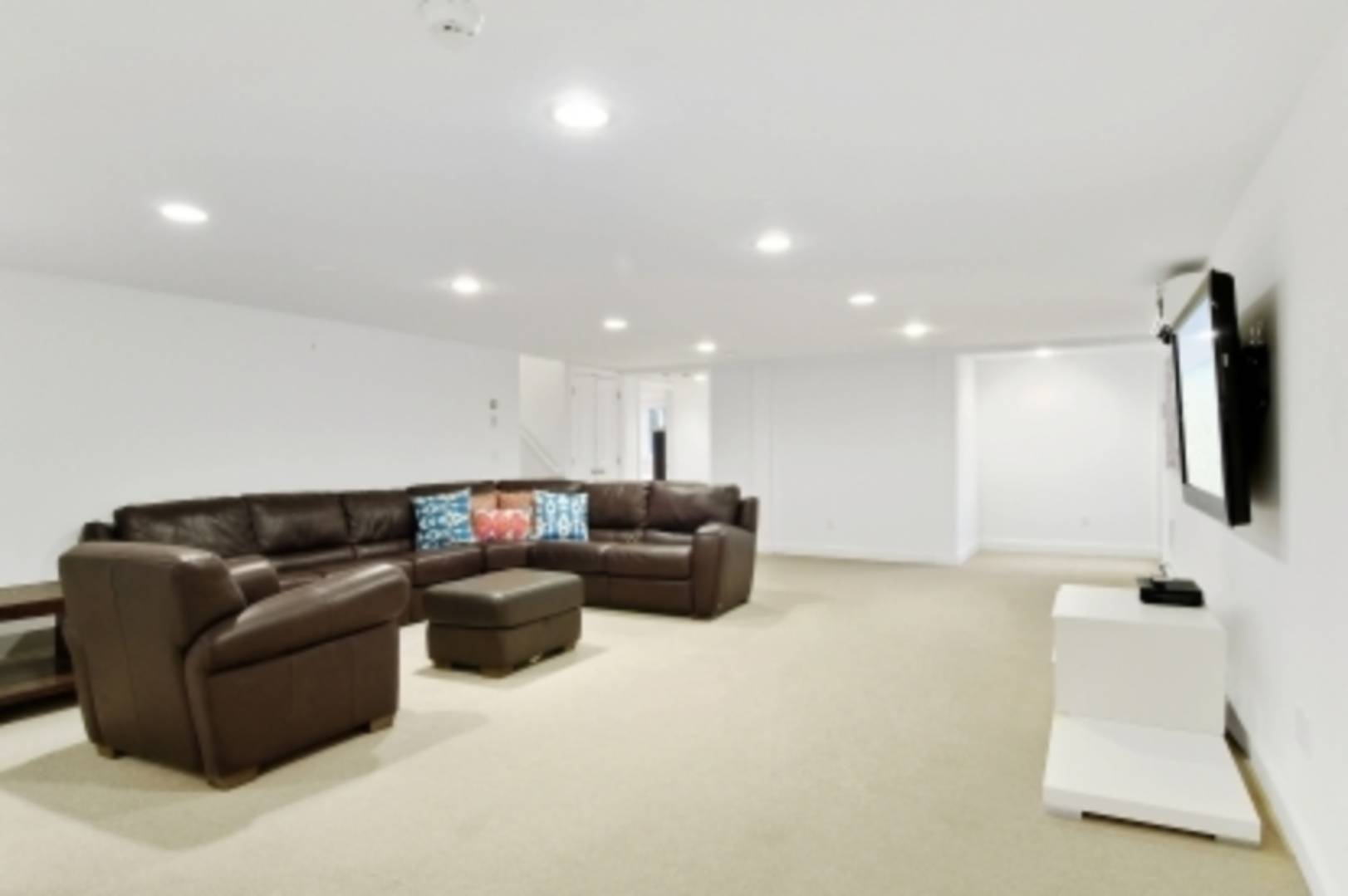 26 Cedar Trail East Hampton, NY 11937 - Photo 13 of 16 a living room with furniture and a flat screen tv