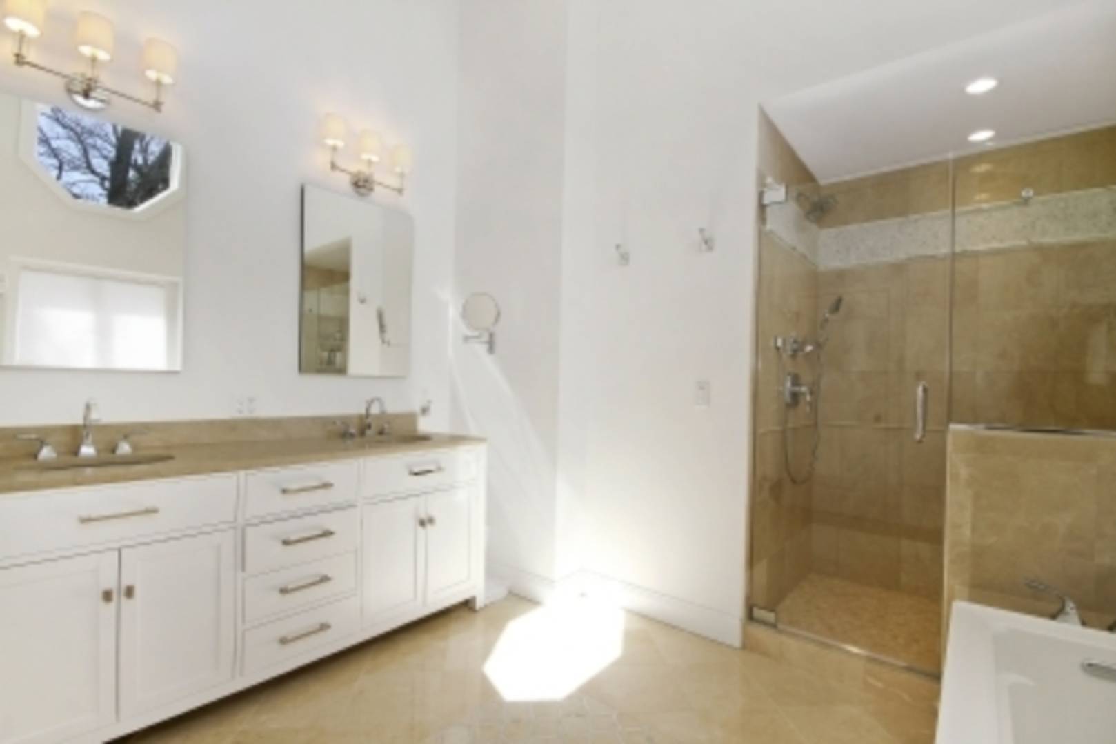 26 Cedar Trail East Hampton, NY 11937 - Photo 7 of 16 a bathroom with a granite countertop sink a mirror a shower and a bathtub