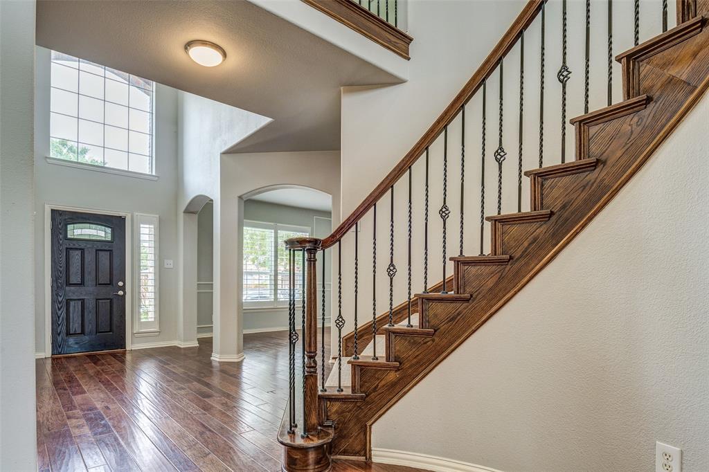 916 Carlsbad Drive Allen, TX 75002 - Photo 1 of 34 a view of an entryway with wooden floor and door