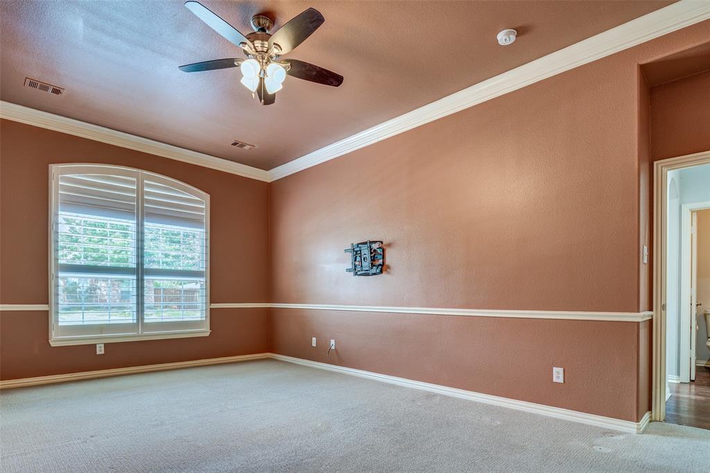 916 Carlsbad Drive Allen, TX 75002 - Photo 17 of 34 an empty room with windows and fan