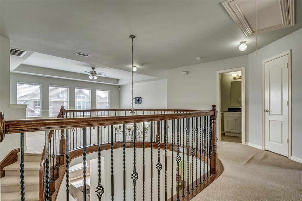 916 Carlsbad Drive Allen, TX 75002 - Photo 20 of 34 a view of a porch with wooden floor and windows