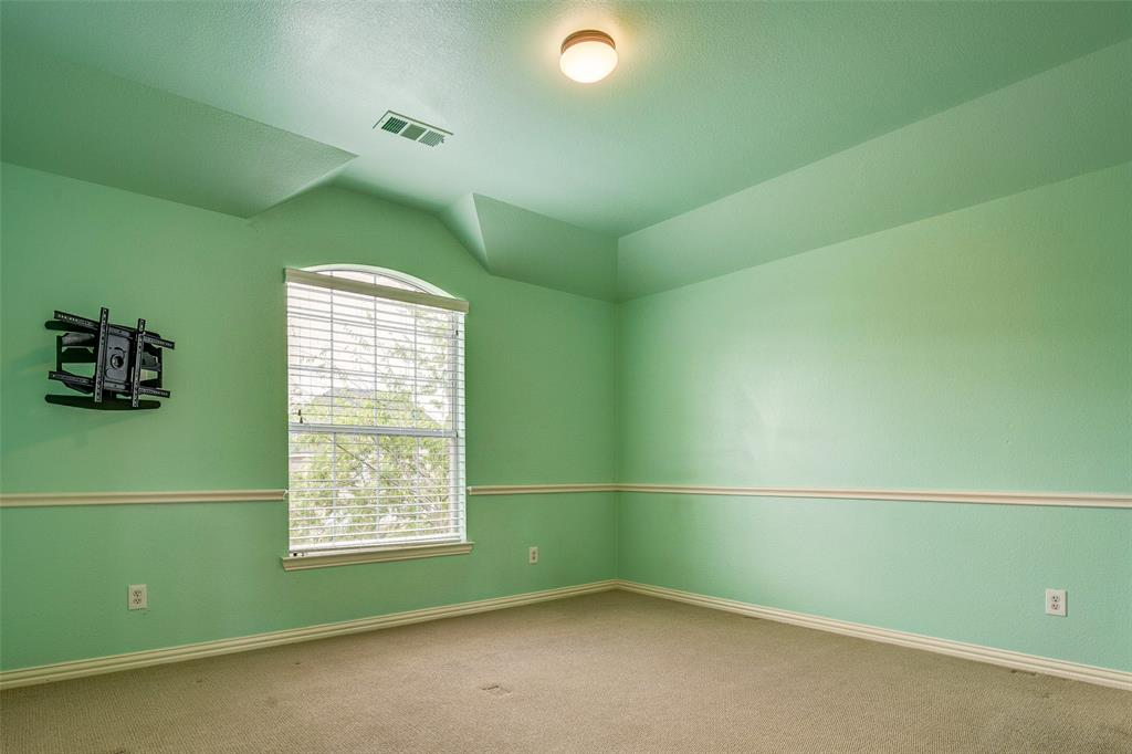 916 Carlsbad Drive Allen, TX 75002 - Photo 29 of 34 a room with a window and a fan